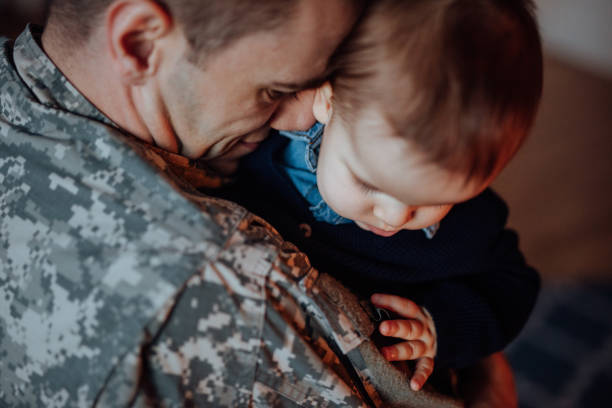 istock Sad military soldier says goodbye to his son 1065370616