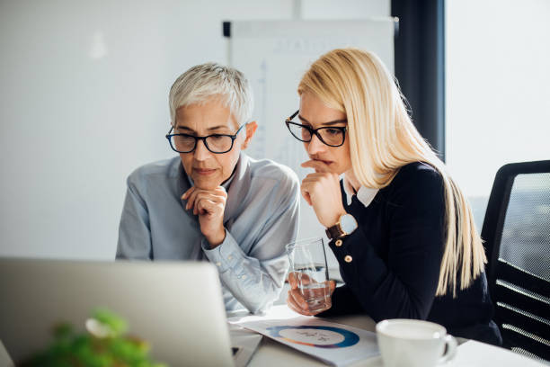 istock Business women looking at laptop 1065374732