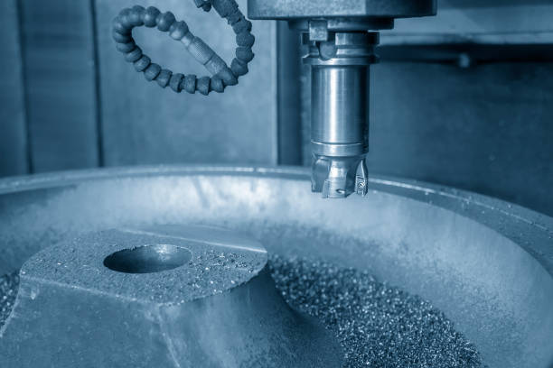istock The  CNC milling machine cutting the mold part . 1065375358