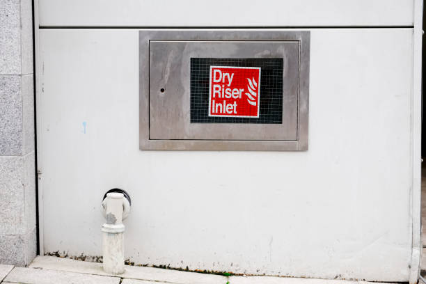 istock Dry riser inlet box stainless steel on wall office workplace sign 1065377564