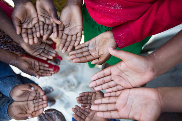 Pleading Hands of African Children Pleading Hands of African Children. begging social issue stock pictures, royalty-free photos & images