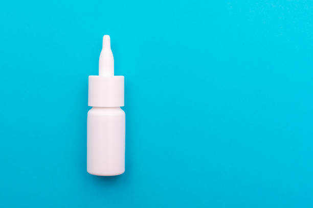 istock White spray cure to the nose on blue 1065380654