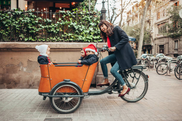 istock Mother riding bicycle during christmas 1065386358