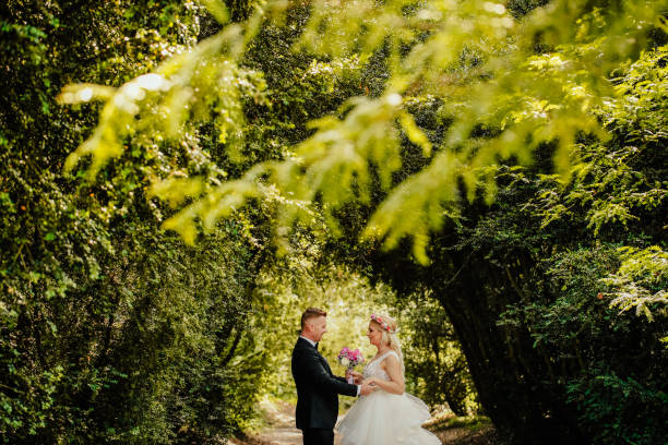 istock Beautiful wedding couple posing in garden 1065386614