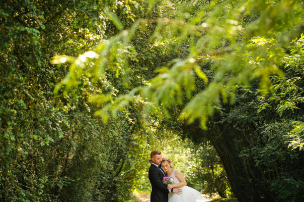 istock Beautiful wedding couple posing in garden 1065386638