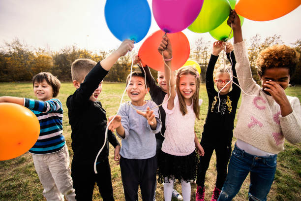 istock Cheerful kids playing with balloon's 1065386776