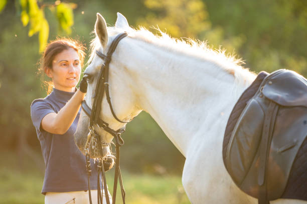 istock Woman with her horse 1065387370