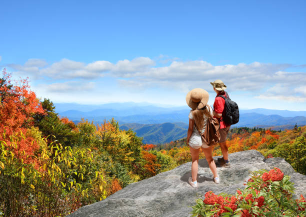 istock Couple on hiking trip lenjoying beautiful autumn mountain scenery. 1065394864