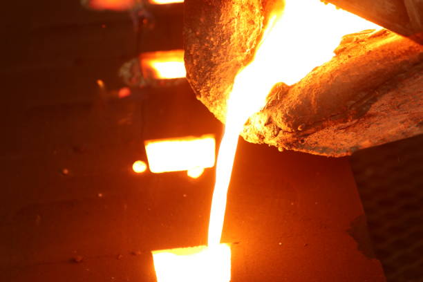 istock Iron molten metal pouring in sand mold 1065395582