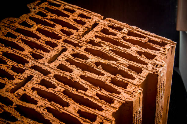 istock building material.chamotte, fireclay isolated.the brick structure close up. porous brick, block isolated on black background 1065395596
