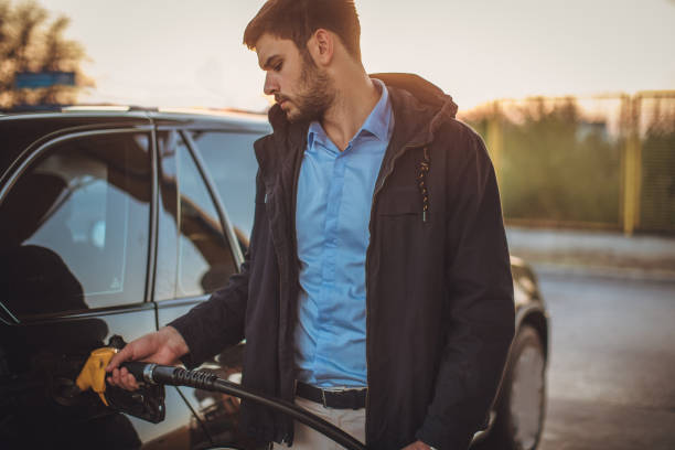 istock Guy at the gas station 1065396930