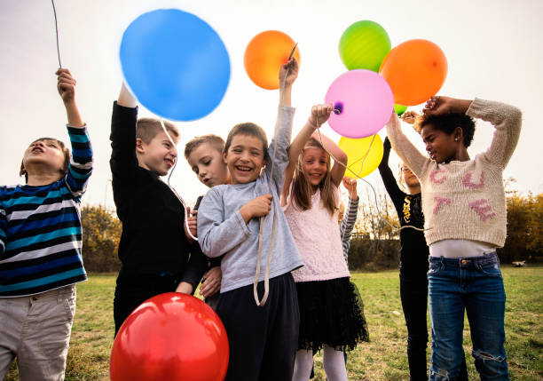 istock Cheerful kids playing with balloon's 1065399534