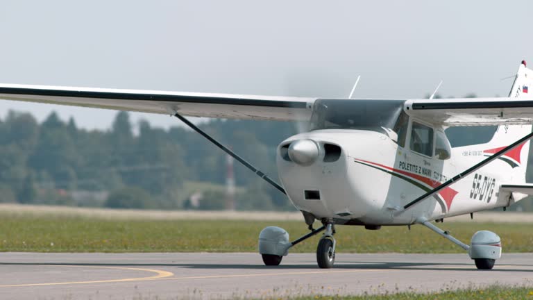 Light aircraft on the runway in sunshine