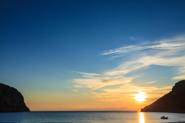 istock Sunrise or sunset over sea surface 1065407396