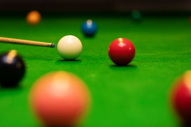 istock snooker game shot - player aiming the cue ball 1065411894