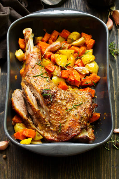 istock baked turkey thigh with vegetables. 1065415936
