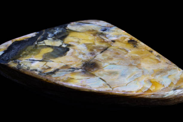 istock Natural polished cabochon simbircite on a black background 1065416864