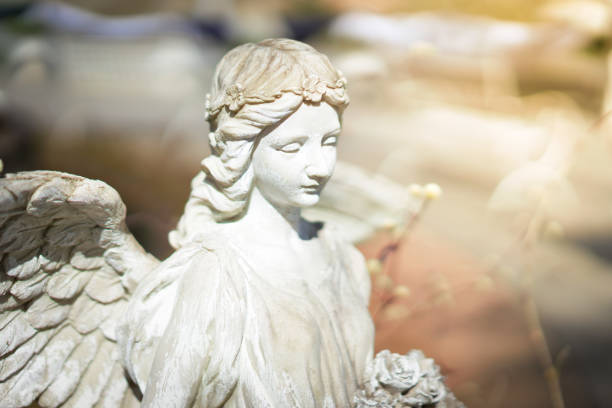istock Beautiful angel statue in sunlight. 1065419672