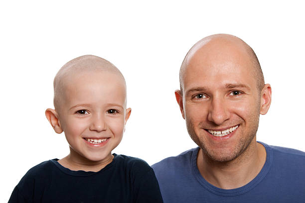 Father and child  completely bald stock pictures, royalty-free photos & images