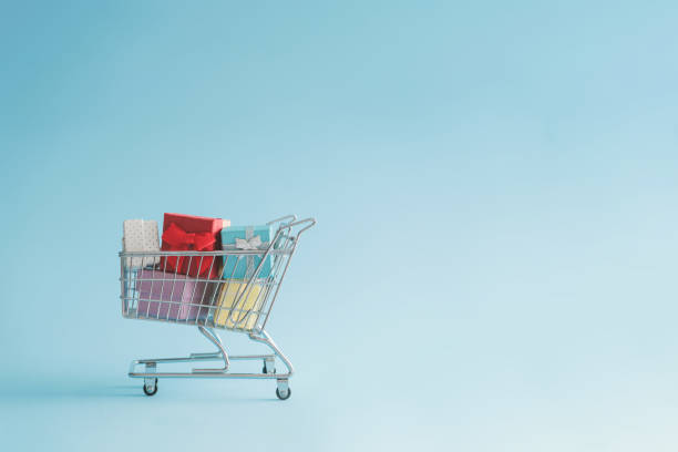 istock Shopping cart full with gift boxes. 1065428150