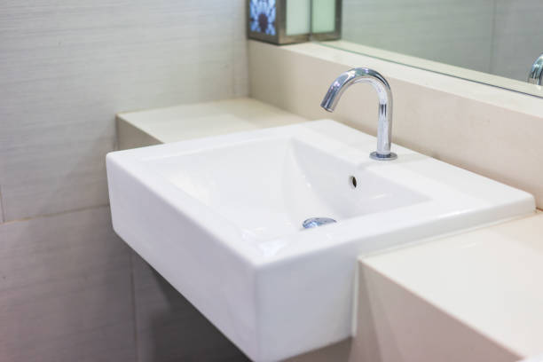 Basin faucets in bathrooms in luxury hotels. Basin faucets in bathrooms in luxury hotels in Thailand. bathroom sink stock pictures, royalty-free photos & images