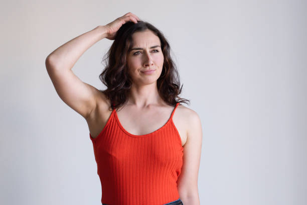 istock Pretty Caucasian girl scratching head in thought 1065430190