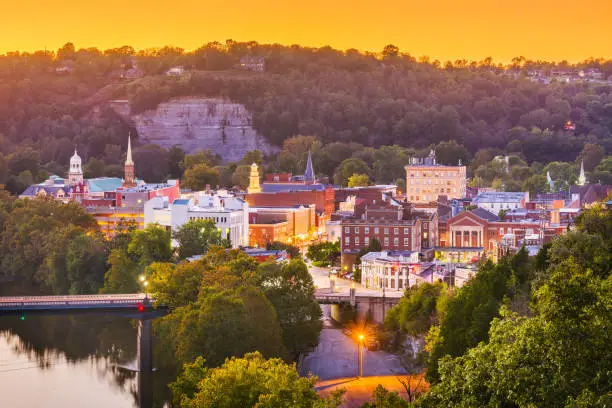 Frankfort, Kentucky, USA town skyline on the Kentucky River at dusk.