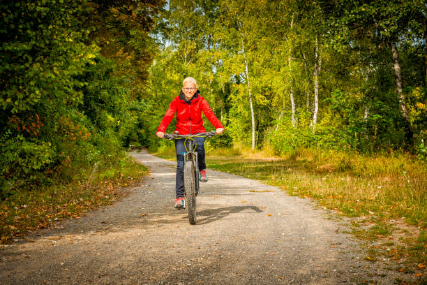 istock woman riding a mountain bike 1065432932