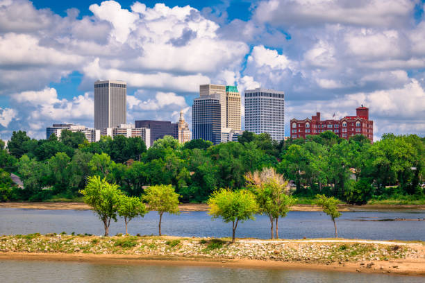 Tulsa, Oklahoma, USA Tulsa, Oklahoma, USA downtown skyline on the Arkansas River at dusk. tulsa landmark stock pictures, royalty-free photos & images
