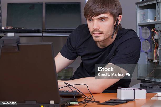 Young Male With Headset Using Computer Stock Photo - Download Image Now - Adult, Cable, Color Image