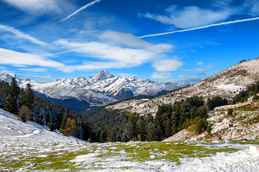 a panorama of french pyrenees mountains with Pic du Midi de Bigorre in background