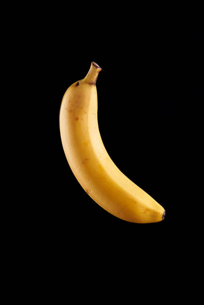 istock banana on a black background 1065438180