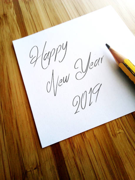 istock Happy new year 2019 written with pencil on paper note 1065439336