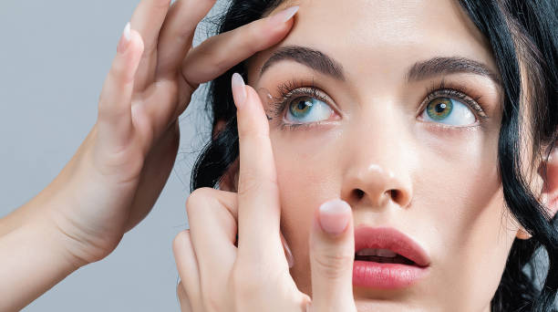 Young woman with contact lenses stock photo
