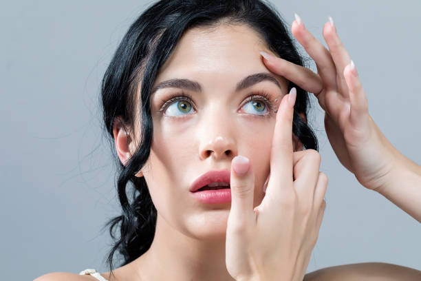 istock Young woman with contact lenses 1065443876