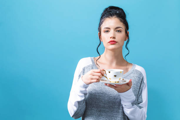 istock Young woman drinking coffee 1065443966