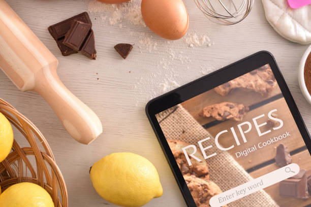 istock Using digital cookbook app in tablet in pastry 1065447822