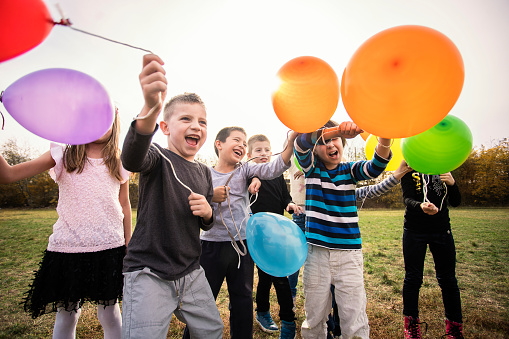 Cheerful kids playing with balloon's