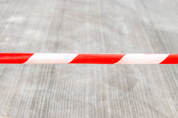 istock red and white striped barricade tape 1065449382