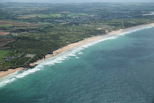 Aerial views Over the coastline of Cornwall at Godrevy Beach, near Hayle on a June day.