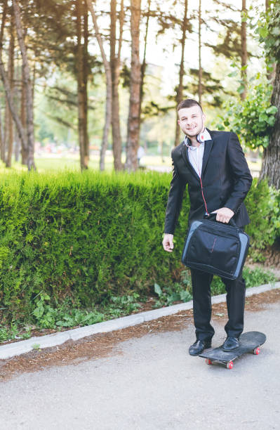 istock Businessman riding skateboard to work 1065449914