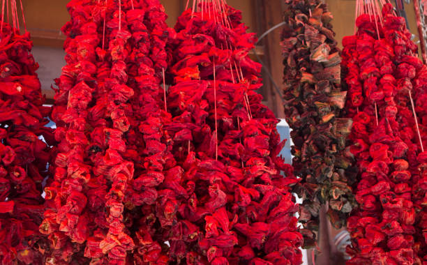 istock Dried red bell peppers and Eggplants hanging on the rope 1065449996
