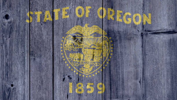 USA Politics News Concept: US State Oregon Flag Wooden Fence
