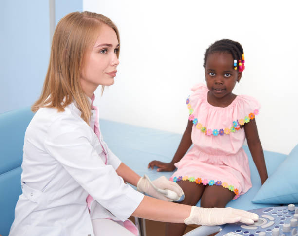 istock Female specialist examines knee joints in child. 1065452486