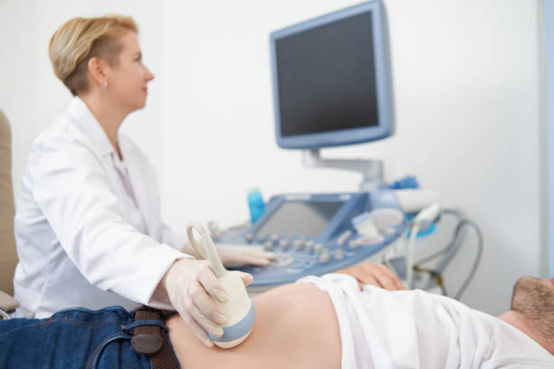 istock Man lying in equipped medical office on examination. 1065452548