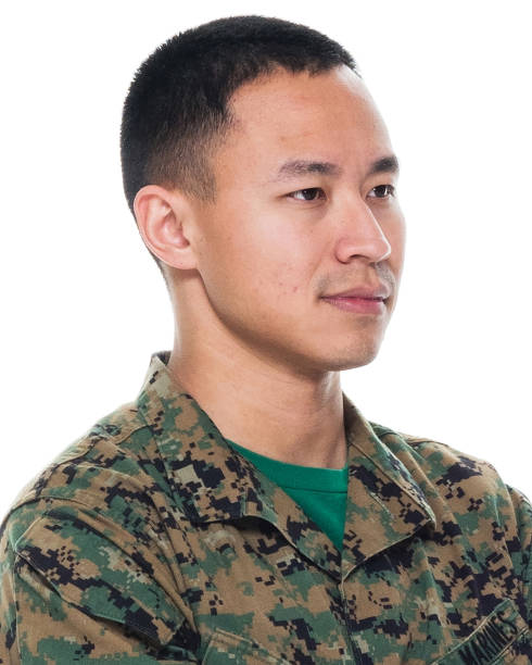 istock US Marine in uniform with arms crossed 1065452708