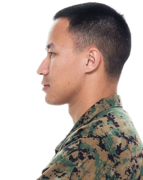 istock US Marine in uniform with arms crossed 1065452710