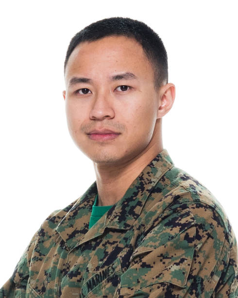 istock US Marine in uniform with arms crossed 1065452756