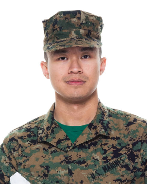 istock US Marine in uniform holding the US flag 1065452836