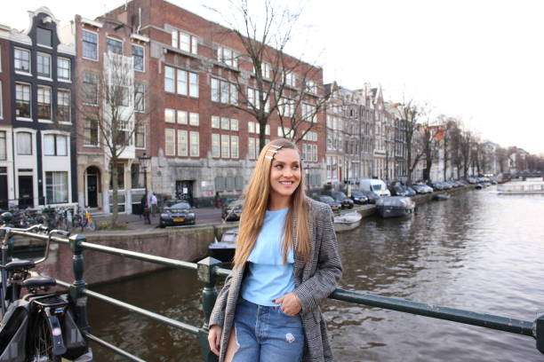 istock Blonde girl posing on historic bridge 1065453614